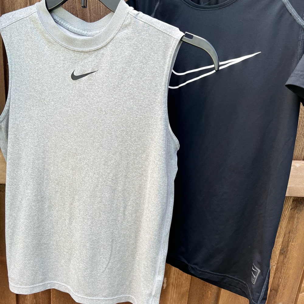 2 boys large Nike shirts